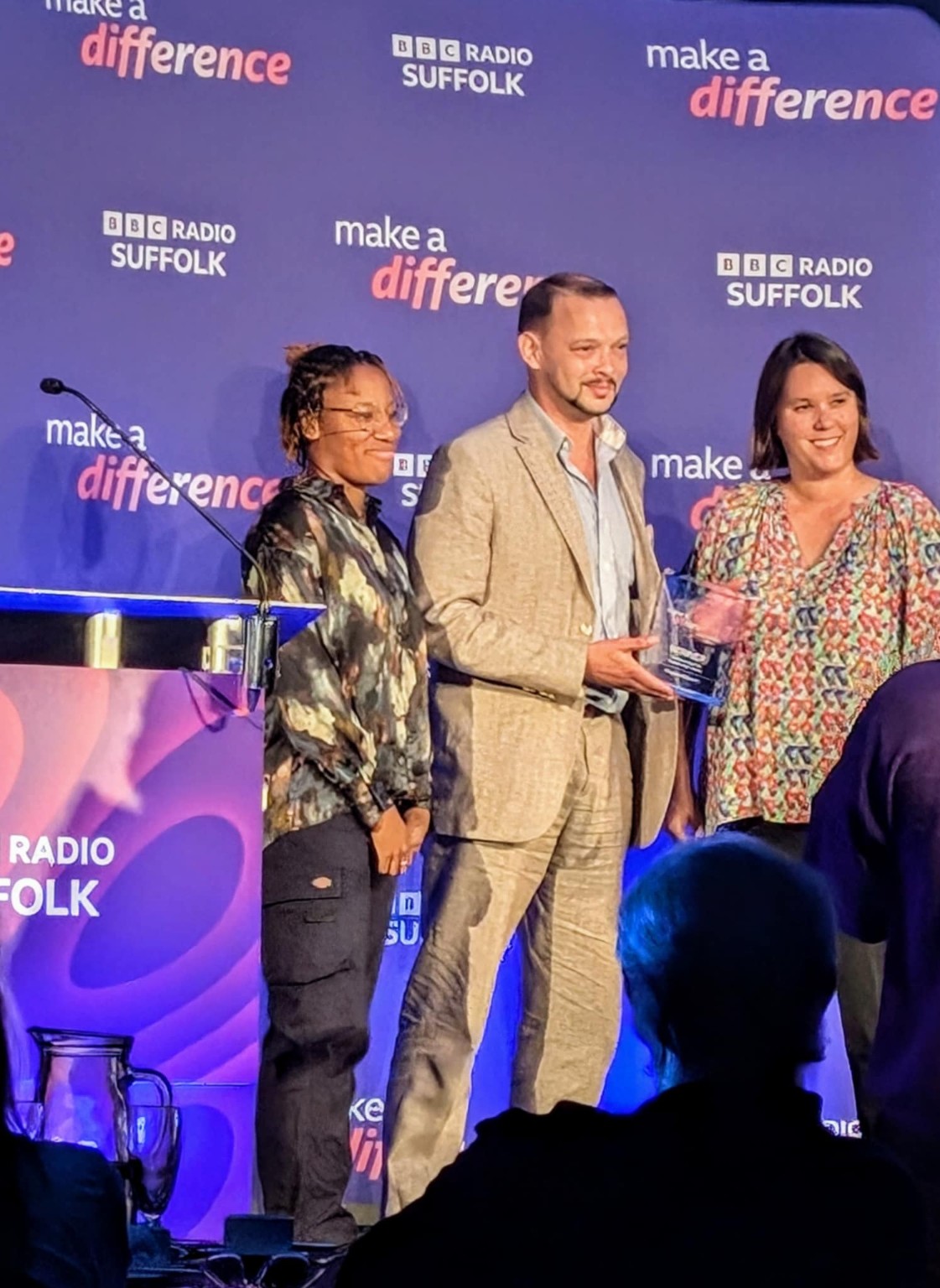Project40Seven receiving the BBC Radio Suffolk Make a Difference award on stage