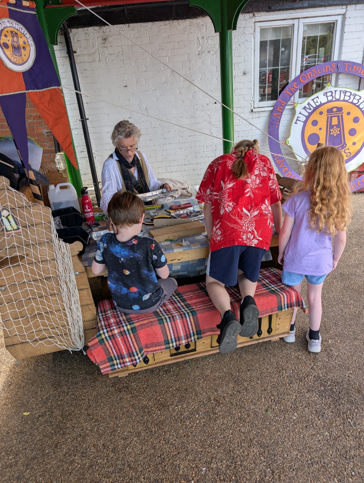 Children and volunteers taking part in craft activities