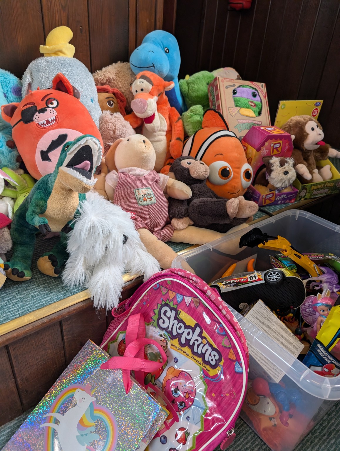 Secret Santa soft toys and children’s gifts arranged together